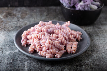 Fusilli pasta with cauliflower. Winter comfort food. Pasta with purple cabbage and goat cheese, winter comfort food ideal for vegetarians.