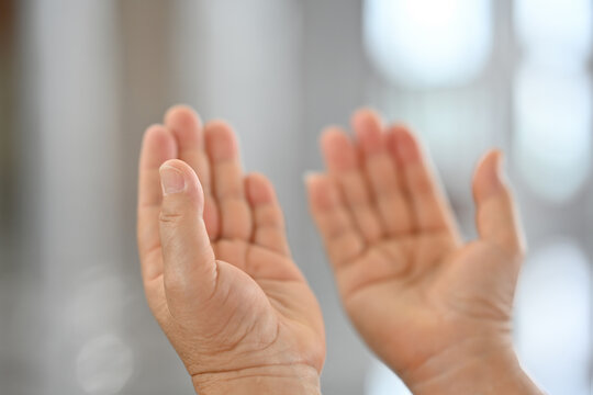 Close-up hands of the woman prayer in the mosque with dua mindfulness and gratitude in faith for Eid. Islam, religion and Muslim person, Spiritual and peace in Ramadan