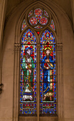 Fototapeta premium Biblical scenes on stained glass giant church window Montpellier 