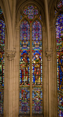 Stained glass windows Montpellier church biblical scenes, saints, angels, and other religious symbols.
