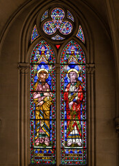 Sunlight shine through church windows colorful stained glass Montpellier
