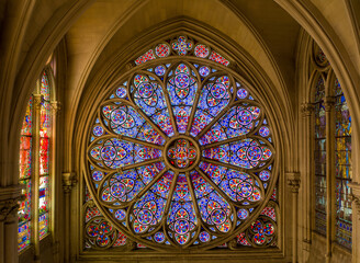  Intricate rose window with biblical imagery.
