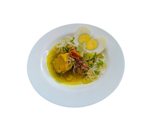 Indonesian chicken soup or soto ayam completed with sliced boiled egg, top view on white plate, isolated on white background