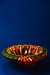 Celebrate Diwali with these shining clay diya lamps, symbols of prosperity and happiness, radiating...
