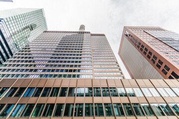Side view on the street canyon in Frankfurt am Main, Germany, with the new Metzler tower in the end. July 2023.