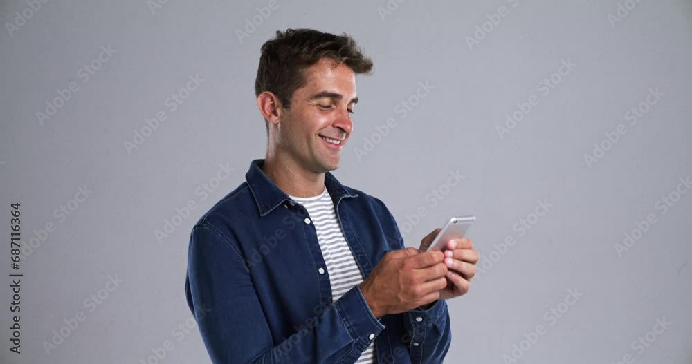 Aufkleber Man, typing and phone in studio with smile for conversation, communication or networking with pride. Person, smartphone and scroll with happiness for discussion, talking or texting on gray background