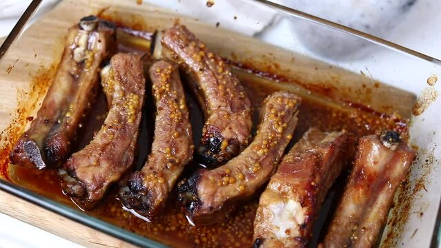 Cooking pork ribs in the oven. Ready-made juicy tasty ribs.