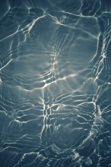 Bluewater bubbles on the surface ripples. Defocus blurred transparent white-black colored clear calm water surface texture with splash and bubbles. Water waves with shining pattern texture background