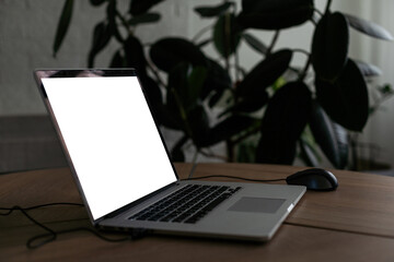 Mock up digital tablet with wireless keyboard on wooden table.