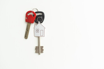 key chain with house symbol and keys on white background, Real estate concept
