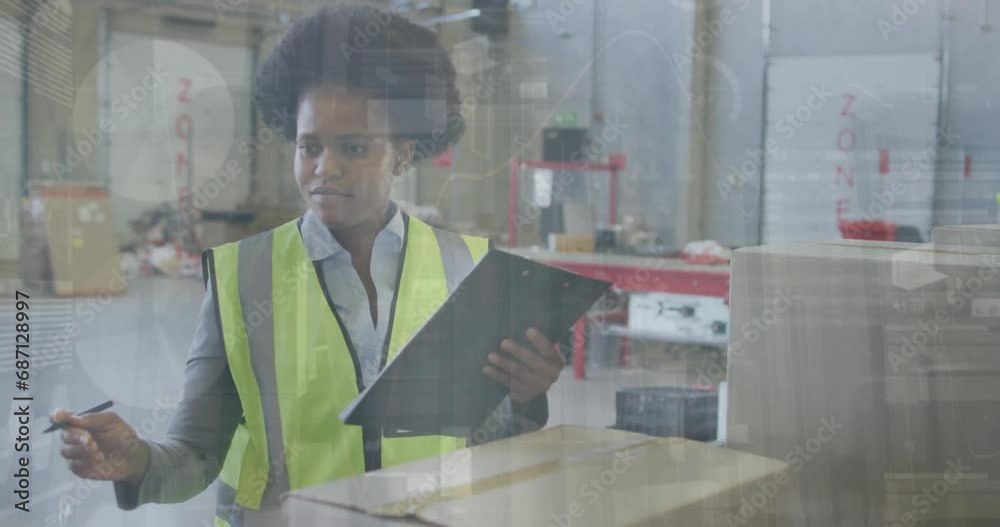 Sticker Animation of financial data processing over african american woman working in warehouse