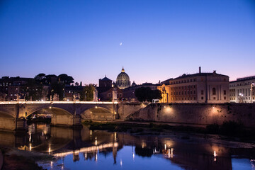 Magic view of Rome in the blue hour, with Saint Peter's Basilica in the background