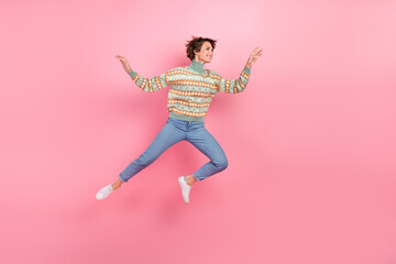 Full length profile photo of funky woman running motion energetic print turtleneck denim jeans shopaholic isolated on pink color background - obrazy, fototapety, plakaty
