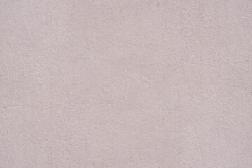 Fototapeta na wymiar pink gray plaster wall of old mediterranean city