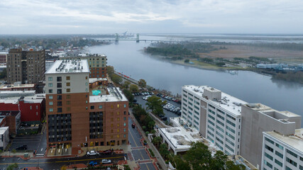 Aerial view of downtown Wilmington, North Carolina, cloudy day and the Caper fear bridge in the background.