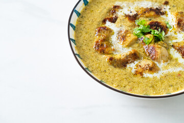 Afghani chicken in green curry or Hariyali tikka chicken hara masala
