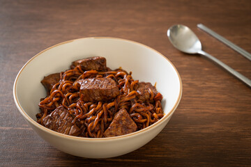 Obraz premium Jjapaguri or Chapaguri, Korean Black Beans Spicy Noodles with Beef