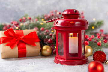 Christmas lantern with Christmas tree branch. Winter decoration background. Lantern with candles and Christmas decorations on a wooden background. New Year and Christmas concept.Banner. Copy Space.
