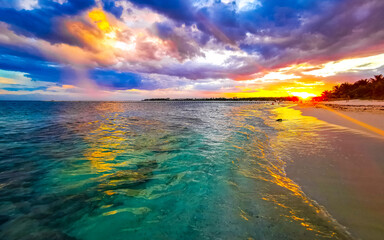 Awesome sunset at tropical Caribbean beach Playa del Carmen Mexico.