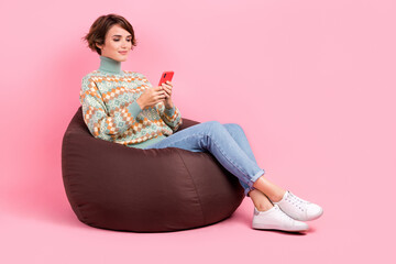 Full body photo of sitting comfortable brown pouf event location zone order taxi smartphone app...