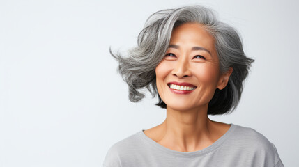 Smiling old asian woman portrait on isolated background - ai generative - obrazy, fototapety, plakaty