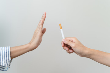 person showing hand sign to rejection cigarette for quit smoke motivation.