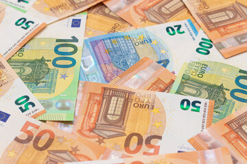 Obraz na płótnie Canvas Different Euro Banknotes Money Background. Euro Money Currency. Colored Paper Money. A Lot of Fifty Euro Bills. Business, Finances, Cash and Money Saving Concept