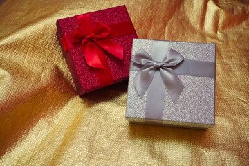 Gifts on a golden textile. background for special moments