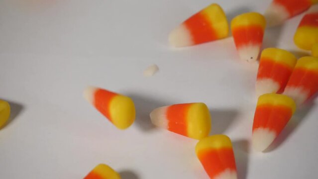 Candy Corn Falling onto a white surface
