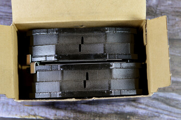 a set of new unused auto brake pads for a car, car service and maintenance and repairing concept,...