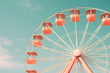 Vintage ferris wheel with blue sky background