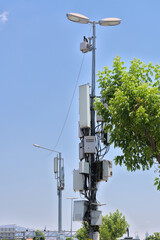 Internet communications and connections. boxes with a bunch of wires are hung on a pole