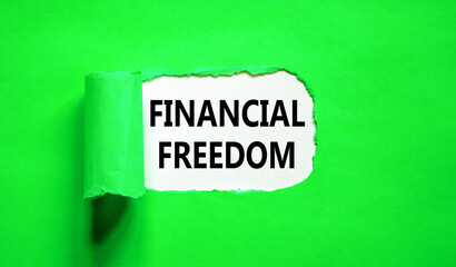 Financial freedom symbol. Concept words Financial freedom on beautiful white paper. Beautiful green paper background. Business financial freedom concept. Copy space.