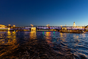 Troitskiy (Trinity) Bridge over the Neva River with night illumination. Saint-Petersburg. Russia