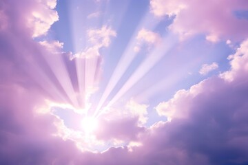 The shining rays of the sun in the sky in bluish pink clouds.
