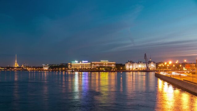 Day to night timelapse showcases Nakhimov Naval School and Peter and Paul Fortress, viewed from Liteyniy Bridge in St. Petersburg. Aurora's absence, reflected in Neva's waters, adds to the spectacle