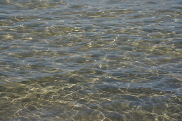 Calm on Mediterranean sea. Sunny seascape. Gentle waves with sea water at daytime