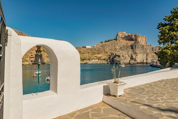 Acropolis view from the small chapel of St. Paul in Lindos village, Rhodes island GR