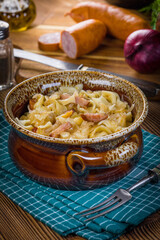 Pasta with sauerkraut and sausage.