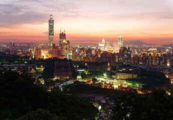 Fototapeta na wymiar Aerial panorama of Taipei City with Taipei 101 Tower among skyscrapers in downtown area at dusk ~ A romantic evening in Taipei, the capital city of Taiwan, with beautiful rosy afterglow in the sky