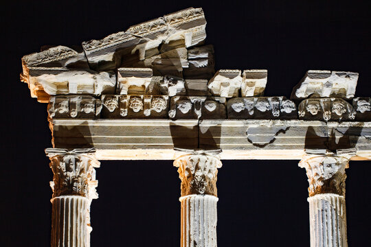 Side, Turkey - October 17, 2023: Temple of Apollo, colonnade upper part with frieze close-up at night, pilasters