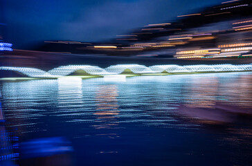 As the tide rises the lights glow over the bridge arches