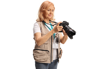Female photographer looking at a camera display
