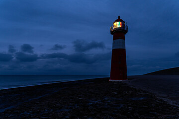 short lighthouse of Westkapelle, Netherlands at dusk