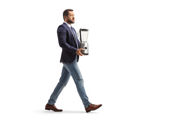 Full length profile shot of a man carrying a food processor
