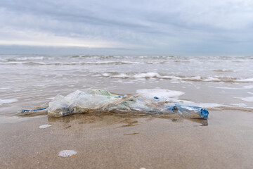 Fototapeta na wymiar plastic waste on sandy beach