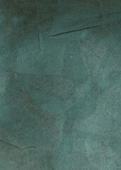 Green texture background for design. Toned rough concrete surface. A painted old paper. Wide...