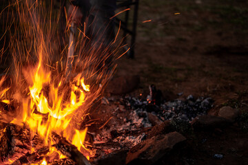 Camp Fire Outside Day Light Evening Shoveling Coals Fire Pit Blurred Long Shutter