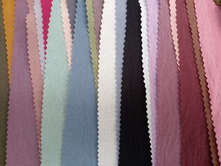 Fabric samples in different colors are laid out for choosing from. Fabric texture close-up. A set...