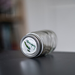 Glass Jar of Dried herb Rosemary with doodled label